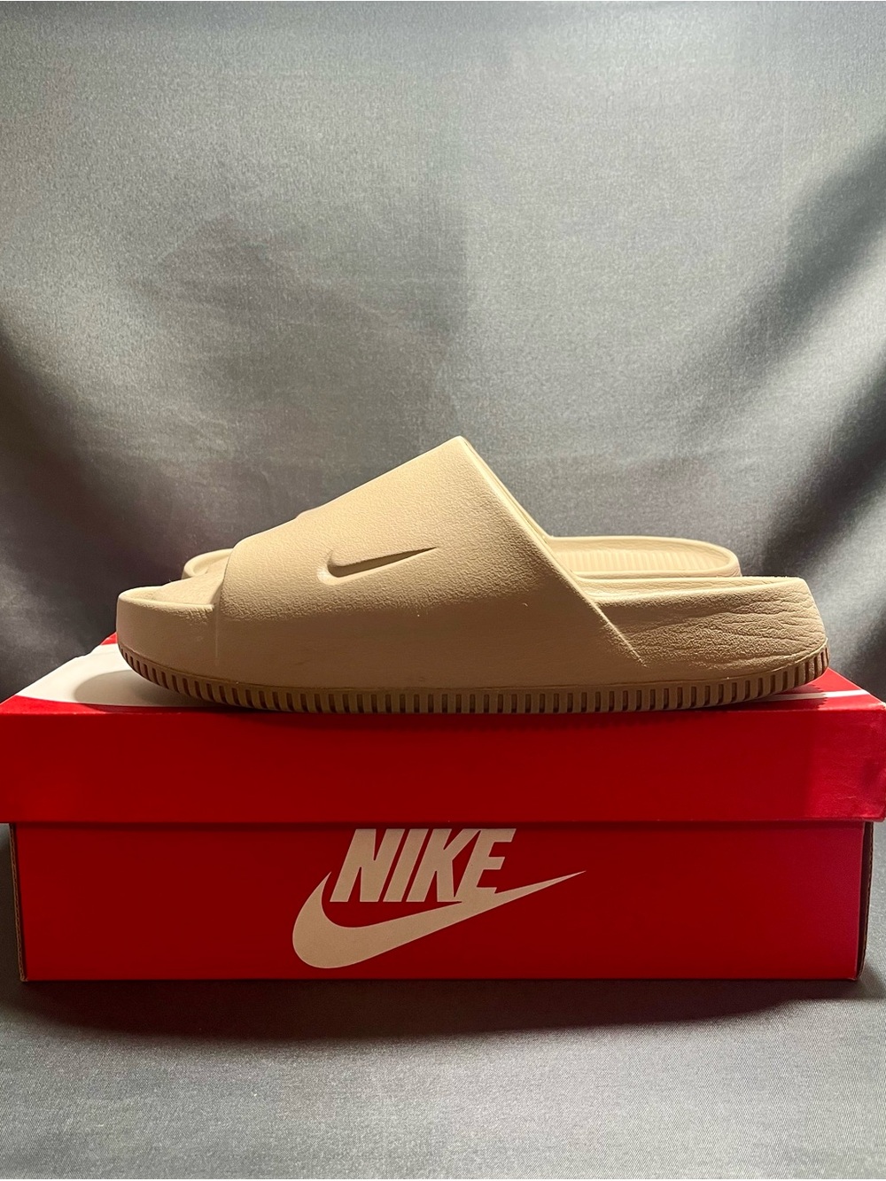 Men’s Nike Calm Slide — a molded, slip-on sandal made from foam.